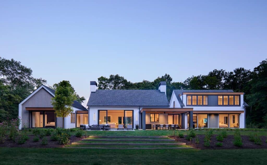 Rear exterior of 33 Cannondale Road illuminated at dusk